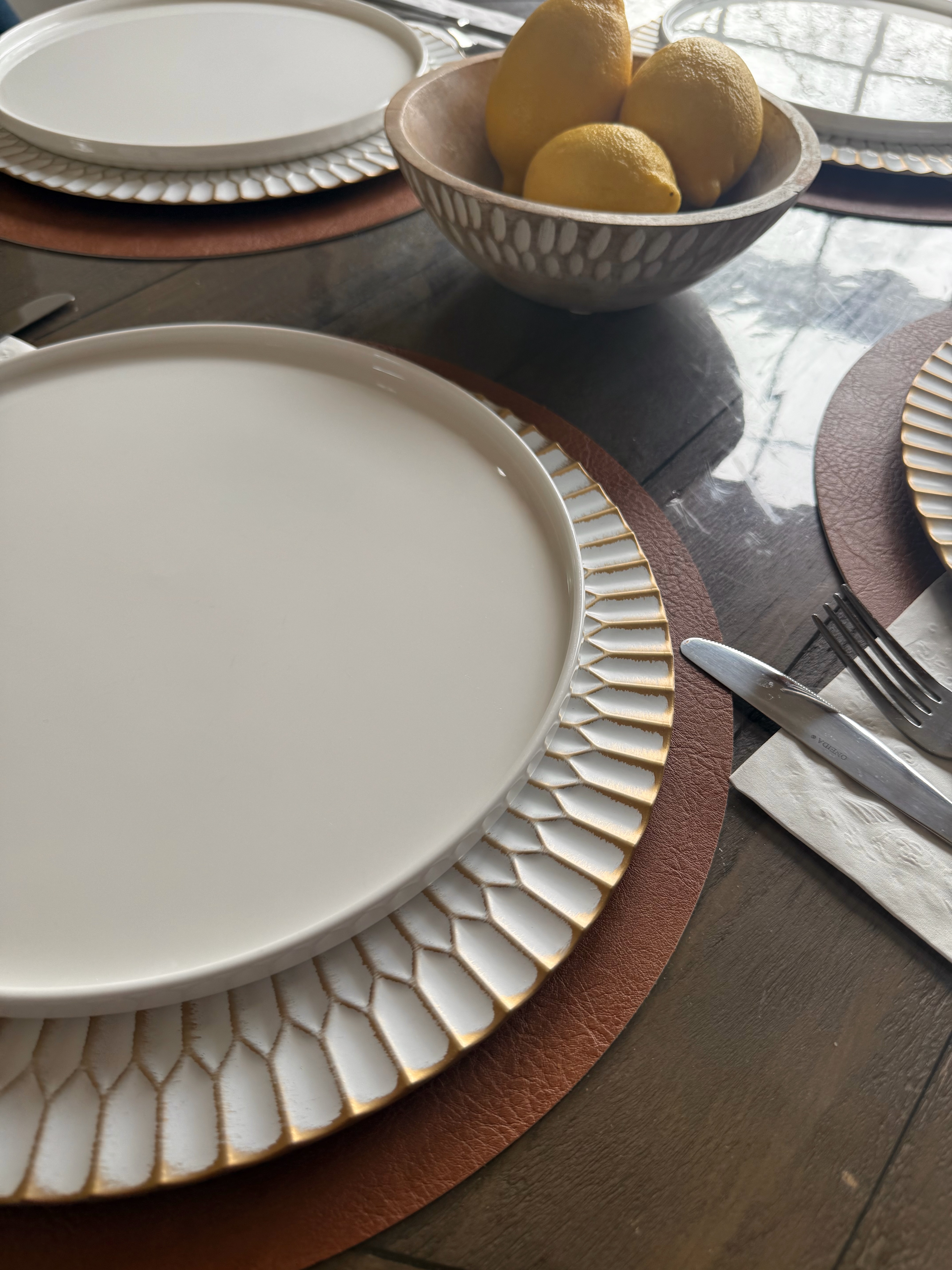 Vegan leather placemats with gold charger plates
