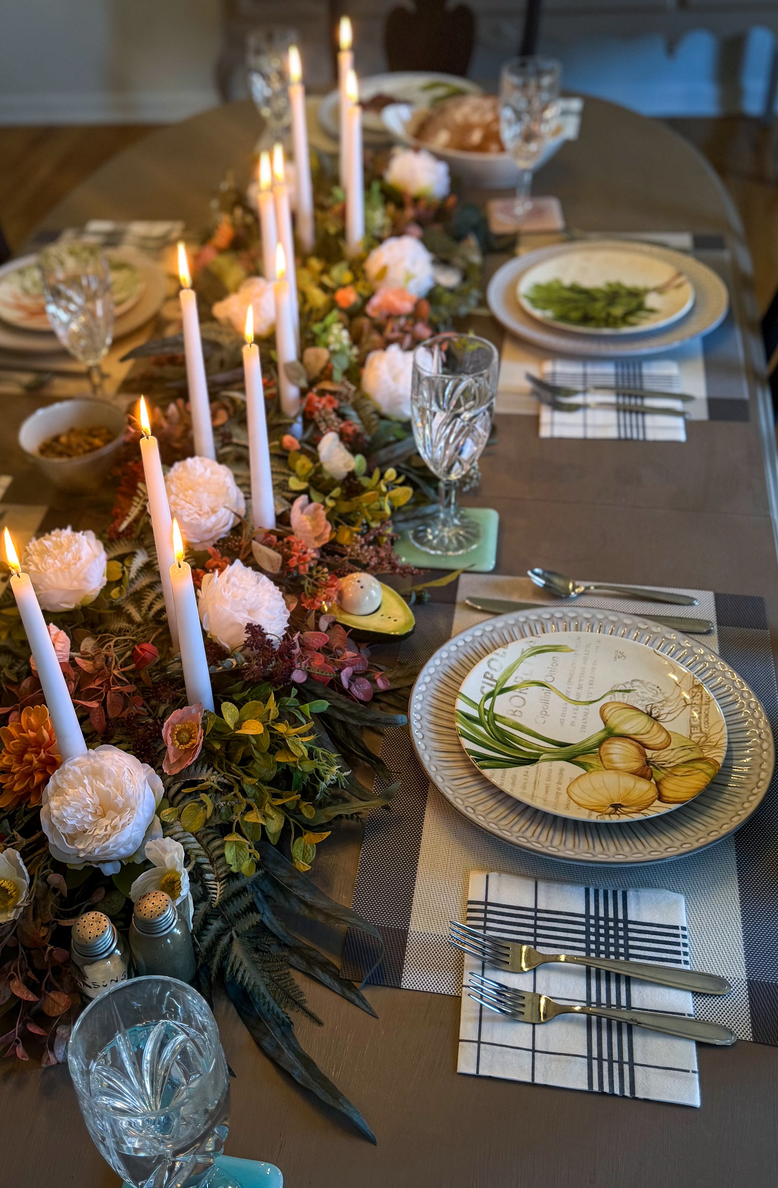 The autumn table with candles and flowers